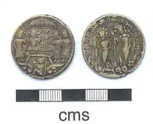 A silvered copper-alloy variant depicting Rama's coronation on one side, and Rama-Lakshmana on the other side