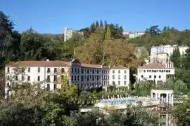 The thermal baths with the castle above