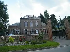 The town hall and school in Molliens-au-Bois