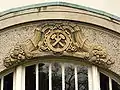 Essen was once a mining town: hammer and pick emblem over the entrance to a house in Schinkelstrasse