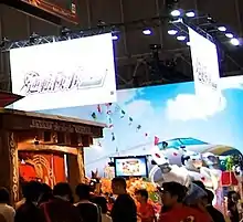 A photo of the Capcom area at Tokyo Game Show 2010, including an Ace Attorney Investigations 2 featuring an inflatable figure of the "Steel Samurai" character.