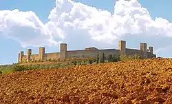 The clay soil of Tuscany (here near Monteriggioni)  is rich in limonite, or hydrated iron oxide, the main component of sienna pigment.