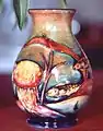 A William Moorcroft vase with fish and 'flambe' glaze, 1930s.