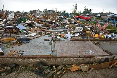 EF4 damage example--Brick homes get reduced to piles of rubble. Above-ground structures are almost completely vulnerable to EF4 tornadoes, which level well-built structures, toss heavy vehicles through the air, and uproot trees, turning them into flying missiles