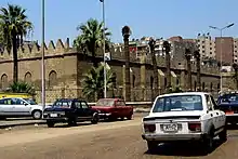 A couple of Nasr 128 in front of the Mosque of sultan al zahir baybars, El Cairo