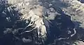 Aerial view of Mt. Wardle (centered), Mt. Verendrye (top, left) and Vermilion River (right)