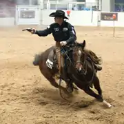 Cowboy mounted shooting at the 2012 AQHA Mounted Shooting World Championship.