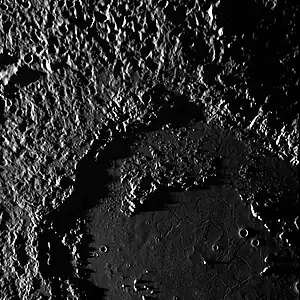 Another MESSENGER image of central and northwestern Mozart, at a low sun angle. Shows the fractures in its smooth floor in bottom right, parts of its peak-ring, and the hummocky ejecta blanket in the upper left.