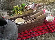 A jar and bowls of baya or bubud (tapuy) in a harvest ritual by an Ifugao mumbaki (shaman)