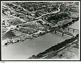 Image 14An aerial view of Murray Bridge in 1953 showing rail and road bridges, and also paddle steamers. (from Transport in South Australia)