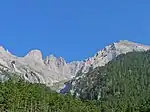 Mountain peak, forest in front