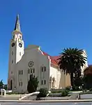 This cruciform church was erected in 1926.
Despite a variety of architectural styles – as evidenced by the high gable walls in particular – the building forms a harmonious unit.
Type of site: Church
Previous use: Church.
Current use: Church : Dutch Reformed.