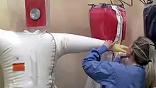 Regular inspection of positive-pressure suits to locate any leaks