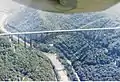 The New River Gorge Bridge as seen from a small fixed-wing airplane. The Tunney Hunsaker Bridge is also visible.