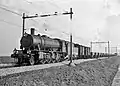 Locomotive NS 4535 (series 4300 "Austerities", ex-WD 77188) with a train consisting of unloaders with gravel (ballast) for the track reinforcement between Amsterdam and Utrecht.