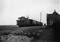 A locomotive of the series NS 7100 with a train at Metslawier station. (1920 - 1940)