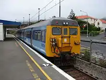 A blue and yellow train at Johnsonville Railway Station in 2007