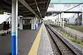 View from the north end of the platform with the waiting room visible, April 2013