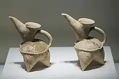 Two white ceramic pitchers (guī 鬹)