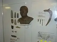 Artifacts and reconstruction of  Eastern Hunter-Gatherers from Yuzhny Oleny island by Gerasimov.