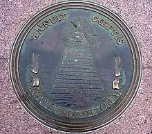 Reverse side of the Great Seal, as depicted by a plaque in Freedom Plaza. (2006)