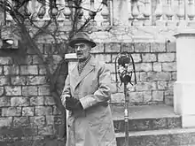 Black and white photograph of Neville Chamberlain speaking in France in 1939