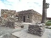 Building and well of the Wranglers Roost Stagecoach Stop.