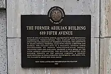 Plaque with the text "The Former Aeolian Building 689 Fifth Avenue"