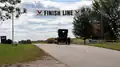 A Model A Ford at the finish line.