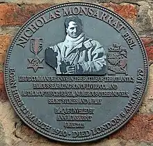 Photograph of bronze wall-plaque with relief sculpture of Nicholas Monsarrat and inscription