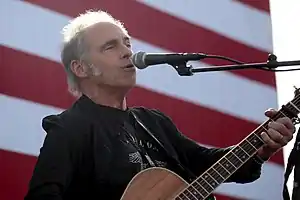 Nils Lofgren playing in 2019