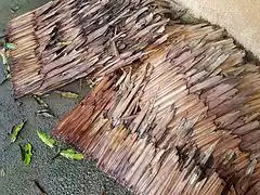 Damaged thatched nipa panels (pawid)