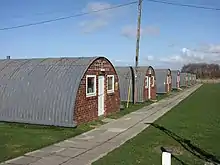 Nissen huts at Altcar Training Camp, Hightown, Merseyside, still in use in 2019. They are often used as filming locations  including the 2019 Russell T Davies drama Years and Years