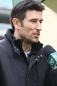 Nomar Garciaparra talking to a journalist in 2010