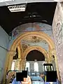 View into the chapel from the entry. Note the dogs tooth motif repeasted in the internal arches.