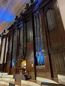 Photograph of Norma the symphonic organ showing the keyboard, pipes and wooden panelling.