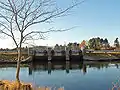 The sluice and bridge barring the lake from the sea.