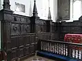 Oak panelling with sculpted heraldry of Parker family of North Molton