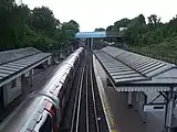 Looking west, with the disused GWR station on the extreme right