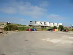 Car park with old gun emplacement visible to left