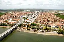 The Do Sal River at bottom; bridge to the left; the city of Nossa Senhora do Socorro top 2/3rds of photo