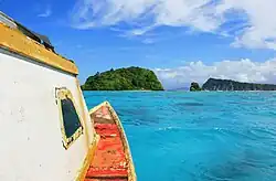 Heading by boat towards uninhabited Nu'ulopa island (left) with Apolima island (right)