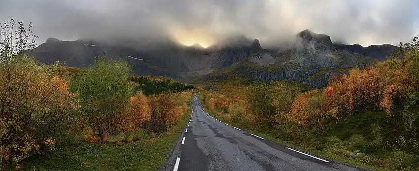 A mountain massif of Flakstadøya island backgrounding the road to Nusfjord village.