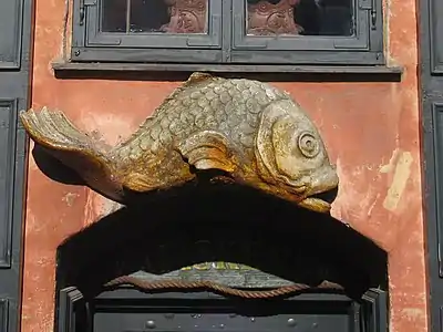 The fish relief above the basement rentrance.