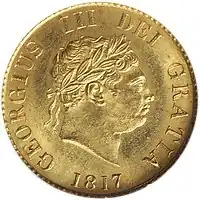 Gold coin showing a man's head facing right