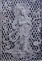 Relief of a Bodhisattva playing a flute on the temple's 8th century Octagonal Lantern.