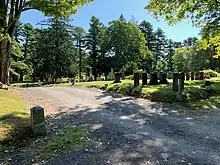 Looking east, Maple Grove Cemetery can be seen across Oak Grove Avenue