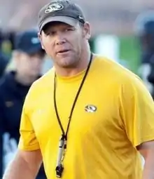 Barry Odom in a t-shirt and hat.