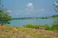 Bank of Oguta Lake showing farmland and vegetation.