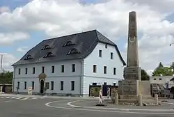 Stone guidepost from 1813and former inn "U Pyrámu" from 1819